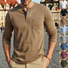 A male model wearing a brown long-sleeve casual shirt with a chest pocket and tan pants.