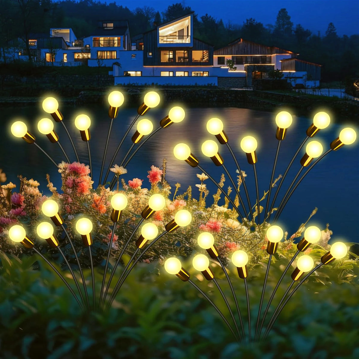 A cluster of glowing yellow solar firefly garden lights with gold accents emerging from green foliage.