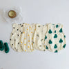 A set of cream-colored baby cotton sleeveless jumpsuit bodysuits with small orange and green leaf patterns.