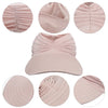 A light pink UV-protective beach hat with a breathable hollow top shown in various views.