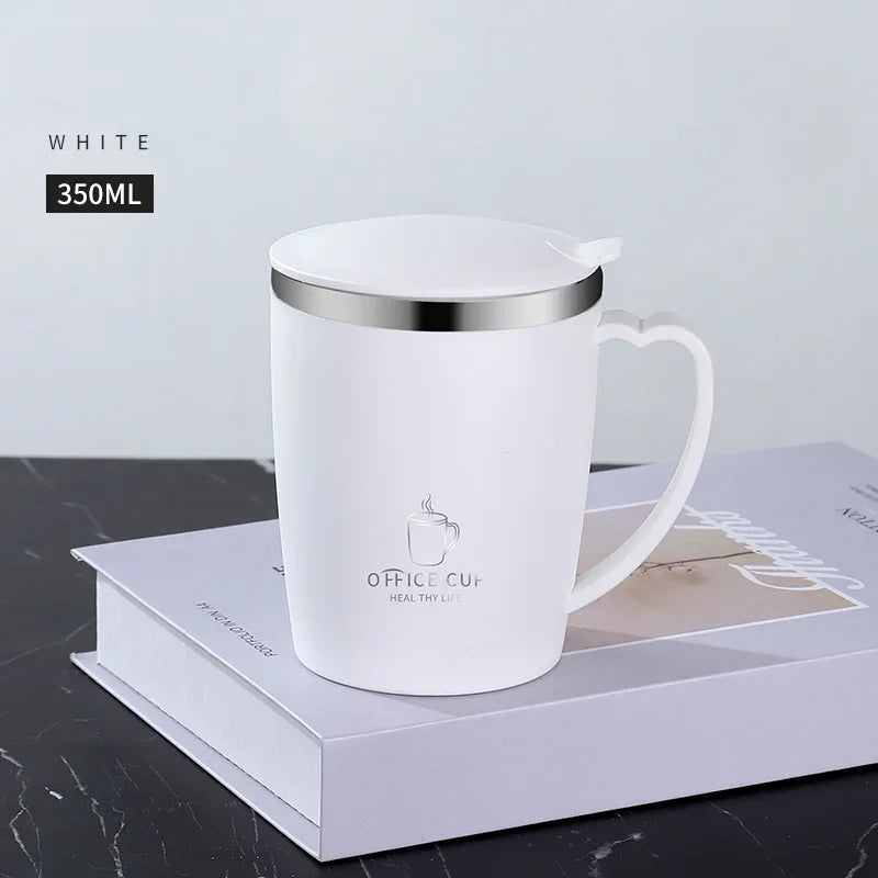 A white 350ml stainless steel insulated travel mug with a handle resting on a light gray box.