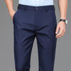 Navy blue men's stretch straight-leg trousers with a light blue shirt visible.