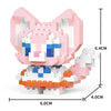 A pink and white micro building block figurine of a fox or canine animal with orange accents.