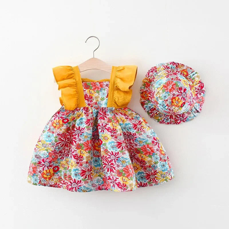 A baby girl's floral print dress with ruffled sleeves and a matching wide-brim hat displayed on a hanger.