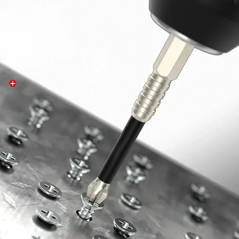 A close-up view of a black magnetic screwdriver bit with a hex shank resting on a metal surface.