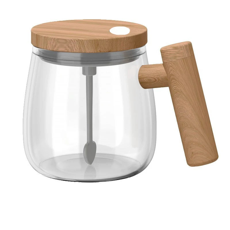 Clear glass mug with a wooden lid and handle, featuring a metal stirring rod.