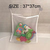 White mesh storage bag with a suction cup closure filled with colorful toys