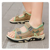 A close-up of a pair of tan and lime green breathable summer sport sandals for boys, showing the adjustable straps and sole.