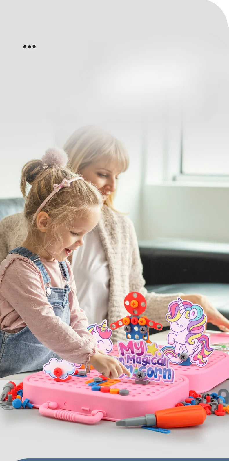 A young girl is using a pretend play repair tool kit with a power screwdriver on a pink plastic board.