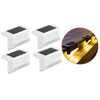 Four white solar powered deck lights designed for outdoor steps, patio, and pathway lighting.