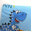 A blue dinosaur graphic on a swim trunk fabric.