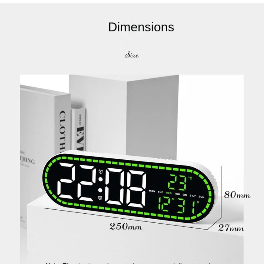 A digital wall clock displaying 22:08, temperature, date, and weekday, shown on a white surface.