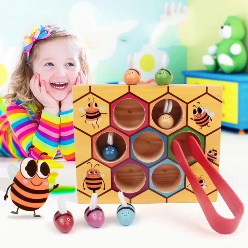 A wooden Montessori bee trap game with various colored bees and parts for fine motor skill development.