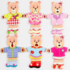 A set of five wooden puzzle dress-up bears in various colors and outfits for children.