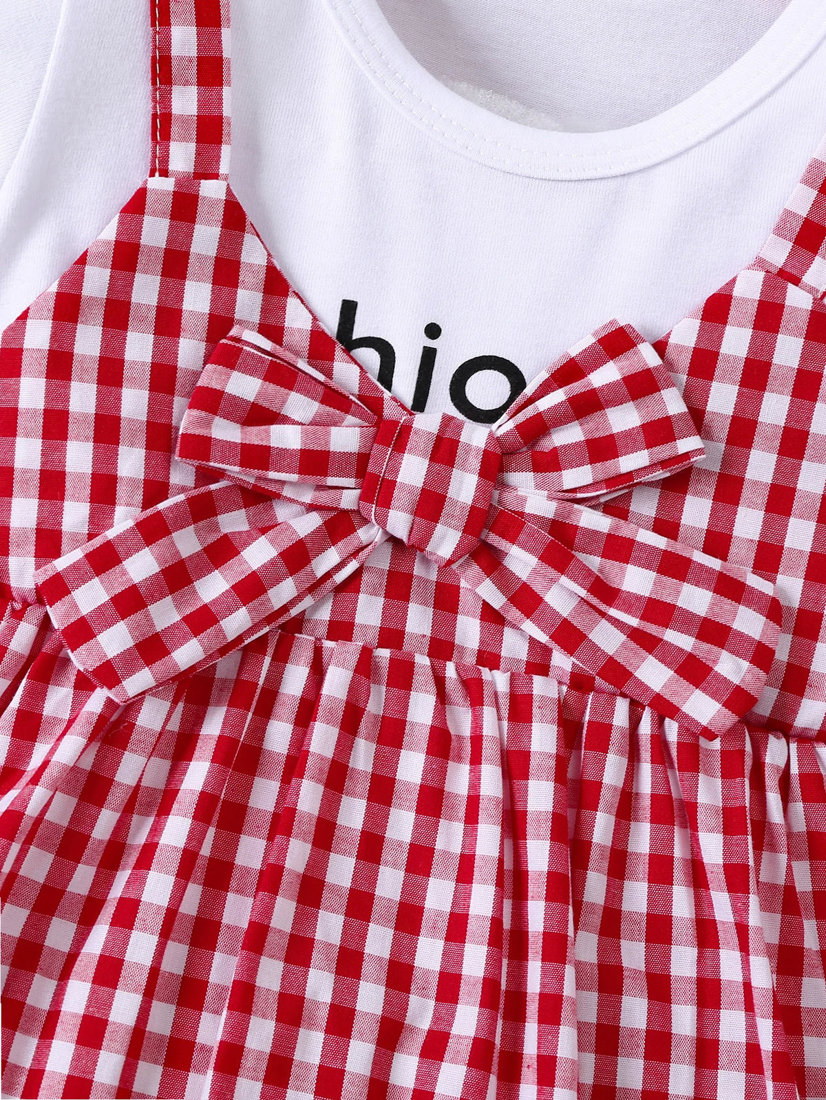 A red and white gingham cotton knit dress for girls featuring a bow detail.