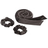 A dark gray velvet heatless curling rod headband rolled into a spiral and a separate coiled version.