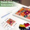 Punch needle embroidery kit featuring a flower pattern on a canvas with yarn and a needle tool.