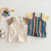 Kids' overalls with colorful striped fabric and a raindrop print, displayed on a white surface.