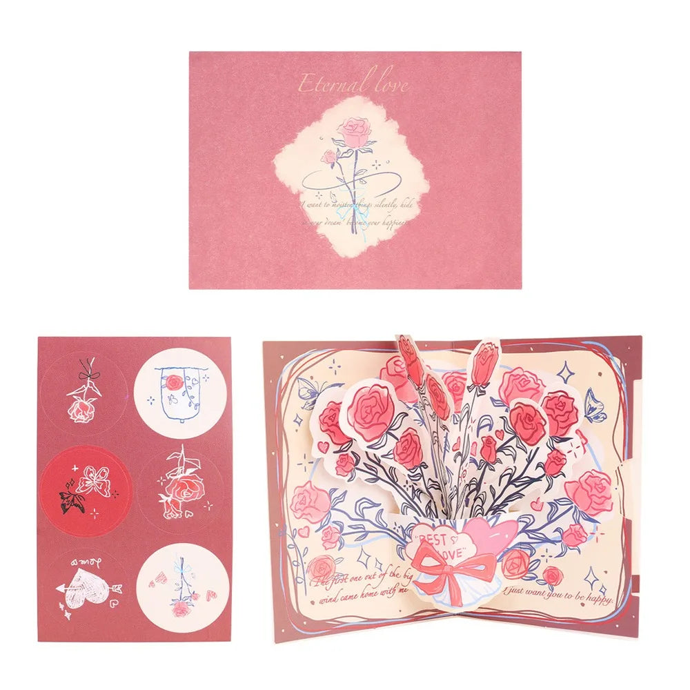 A pink card featuring a floral design and a couple silhouette on the front, with accompanying circular elements.