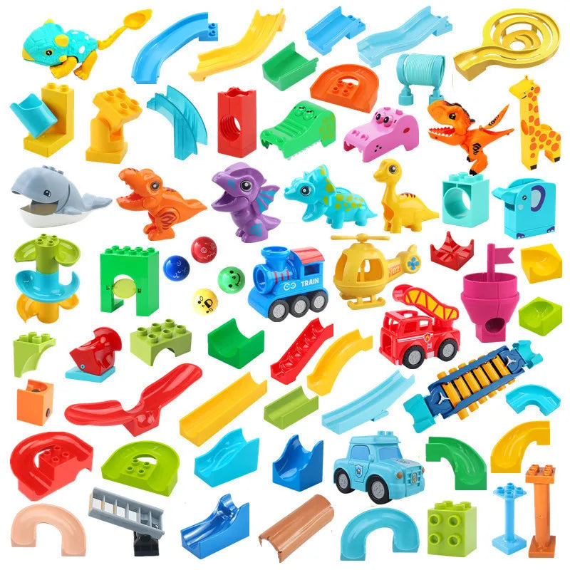 A collection of colorful marble run building blocks, tracks, and funnels for construction.