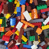 A bulk pack of classic building bricks in various colors including red, yellow, brown, blue, and green.