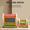 A wooden rolling drum toy with colorful stacked rings used for sensory development and concentration.