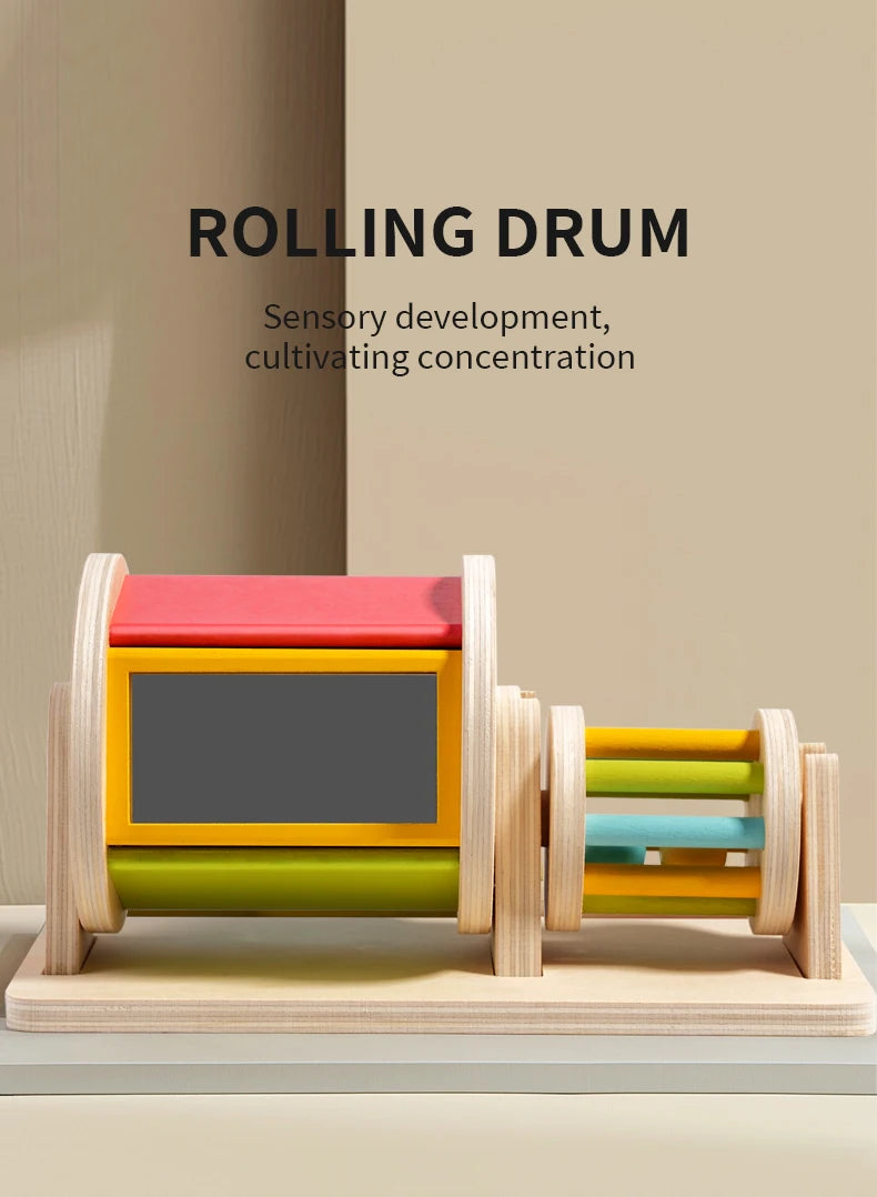 A wooden rolling drum toy with colorful stacked rings used for sensory development and concentration.