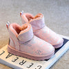 Pair of pink girls winter snow boots with faux fur lining and glitter accents