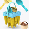 A set of yellow and blue beach castle sand play accessories including a shovel, scoop, and various molds.