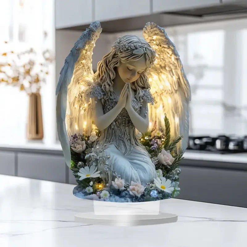 Akryl-skrivebordsfigur av en bedende engel med gjennomsiktige vinger og blomsterdetaljer