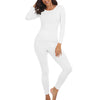 A woman models a white long-sleeved thermal top and matching leggings.