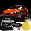 Orange ceramic car wax product displayed next to a yellow applicator sponge.