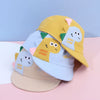 A yellow and light blue toddler sun hat with rabbit ears and embroidered text