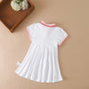 White kids summer cotton dress with a red and white turn-down collar displayed on a neutral background.