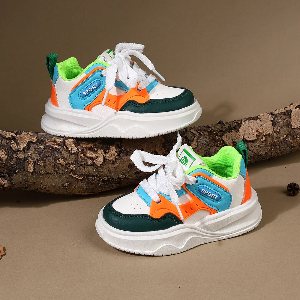 A pair of kids' breathable casual sneakers featuring white, teal, orange, and green accents on a light brown background.