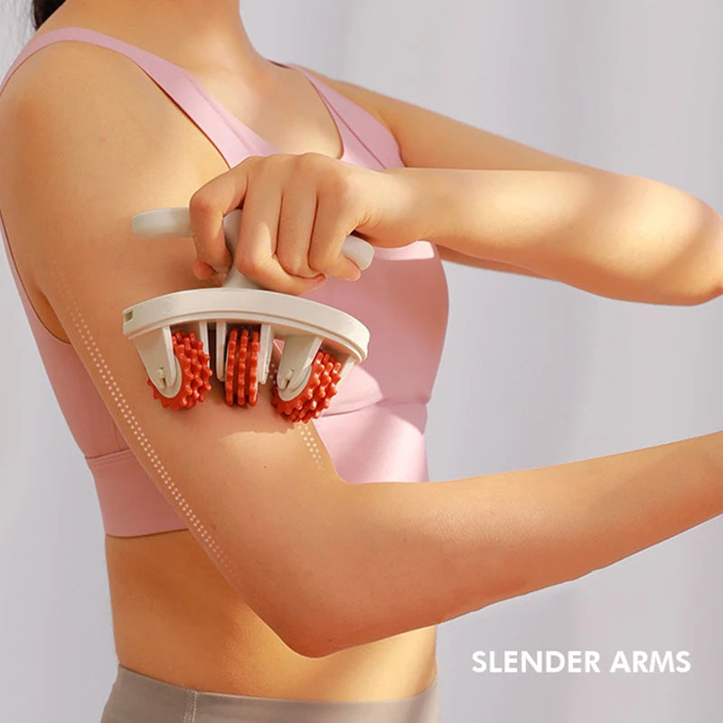 A woman is using a pink full body massage roller with detachable red handles on her arm.