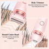 A pink body trimmer with an upright head and a round cutter head shown trimming hair on skin.