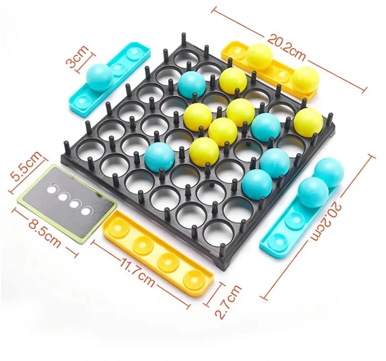 A black plastic grid with multiple circular holes holds colorful foam balls in yellow and blue.