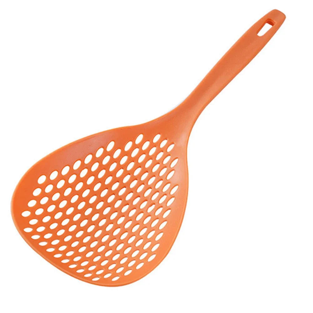 An orange long-handled kitchen strainer spoon with a perforated mesh surface.