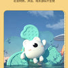 A cute white cartoon animal floating on a green suction cup spinner bath toy in water.