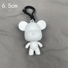 A white bear figurine with black hanging loop, shown against a gray background.