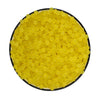 A circular arrangement of small, yellow water beads.