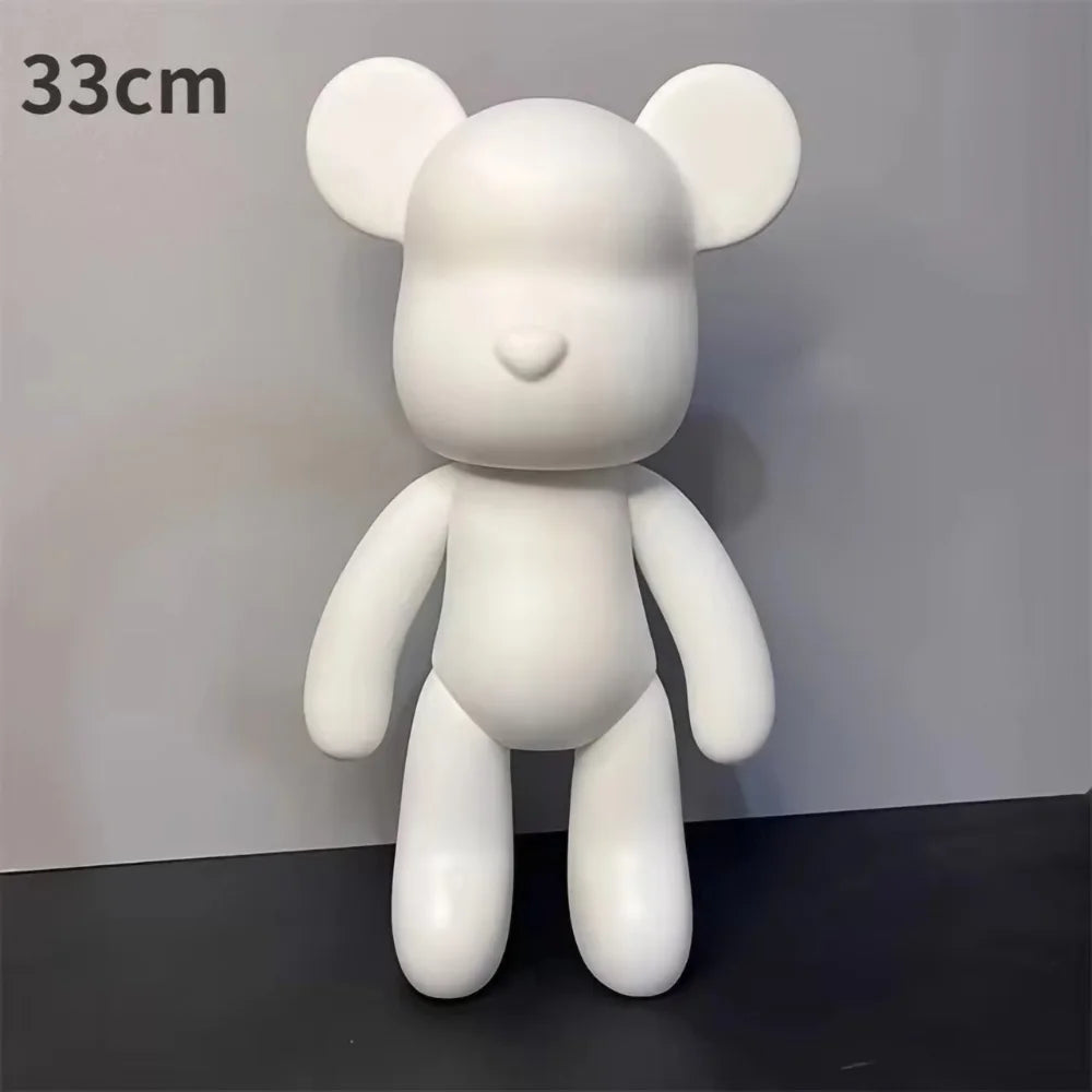 A white bear figurine with large ears is shown against a gray background.