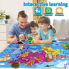 A father and daughter are using a felt story board map of the world featuring various zoo animals for interactive learning.