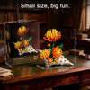 A small box set of Chrysanthemum Conch building blocks featuring orange and yellow floral designs.
