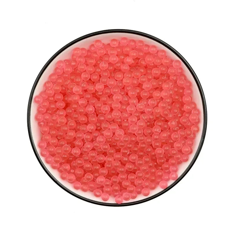 A bowl filled with 300 colorful pink water beads.