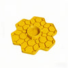 A yellow honeybee watering station with a honeycomb tray and perch.