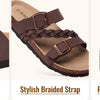 Brown women's slide sandals featuring adjustable buckles, a stylish braided strap, and a premium cork footbed.