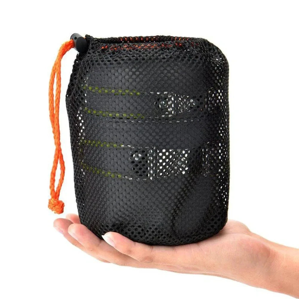 Black mesh kit for outdoor adventures with orange cord and green accents