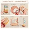 A collection of seven wooden musical instruments including a cloud-shaped xylophone, moon tambourine, sun rattle, star rattle